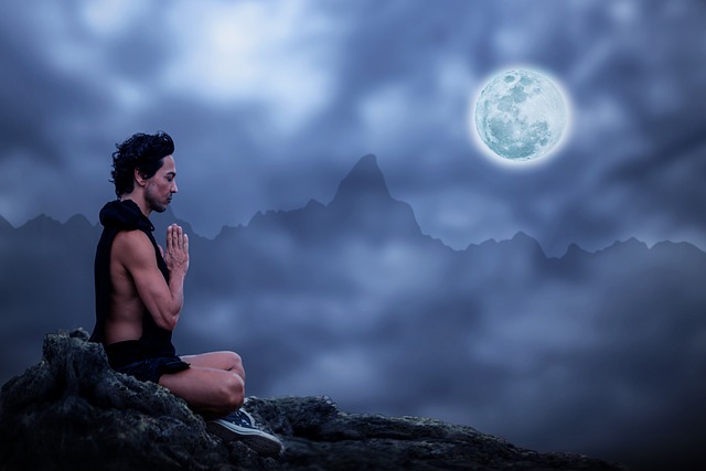 Yoga for Better Sleep | Including Meditation for Restorative Sleep | Fit male meditating on a mountain top at night under a full moon | Organic Wellness Naturals